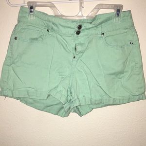 Teal jean shorts.